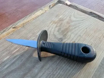 Plastic handle oyster shucking tool